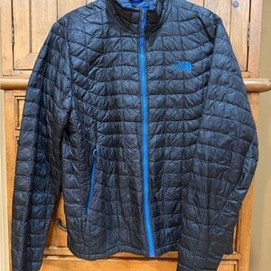The North Face Men's Thermoball Blue full zip Jacket with Blue zipper and Logo
